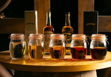 5 containers with whiskey inside