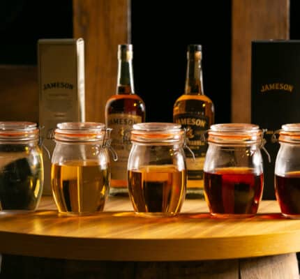 5 containers with whiskey inside