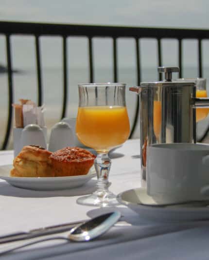breakfast on the terrace pictured orange juice, a scone and a muffin