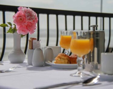 upclose setting of breakfast with orange juice