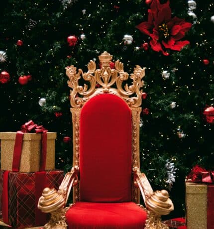 santas chair infront of christmas tree