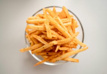 Chips in a bowl with a white background
