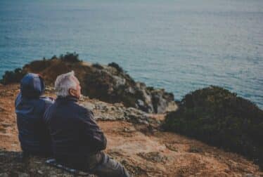 Old couple overlooking sea