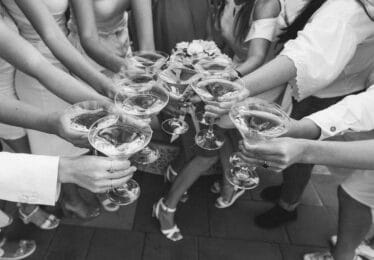 people doing a cheers with martinis